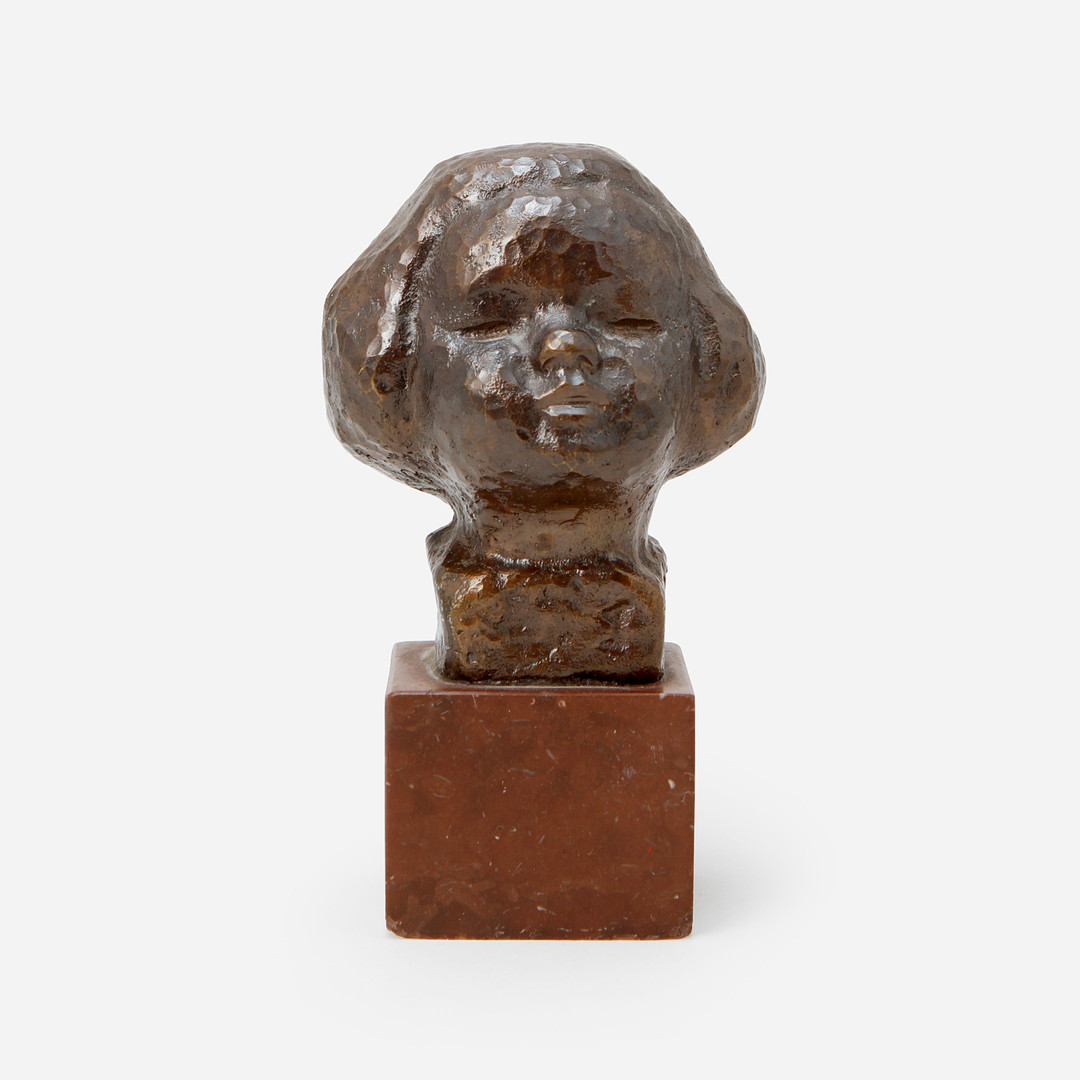 Barnhuvud, skulptur, signerad.