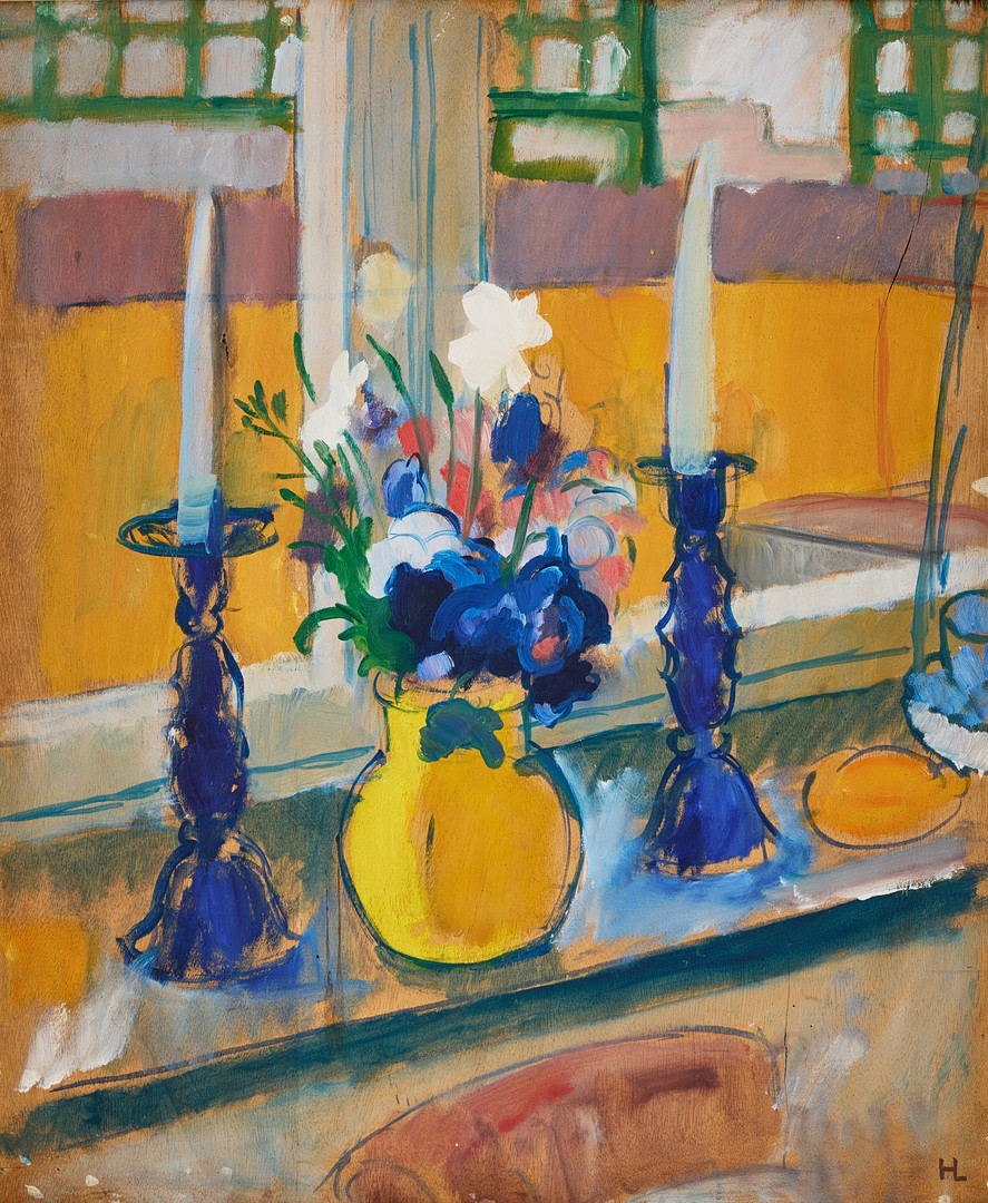 Flowers and candlesticks on a windowsill.