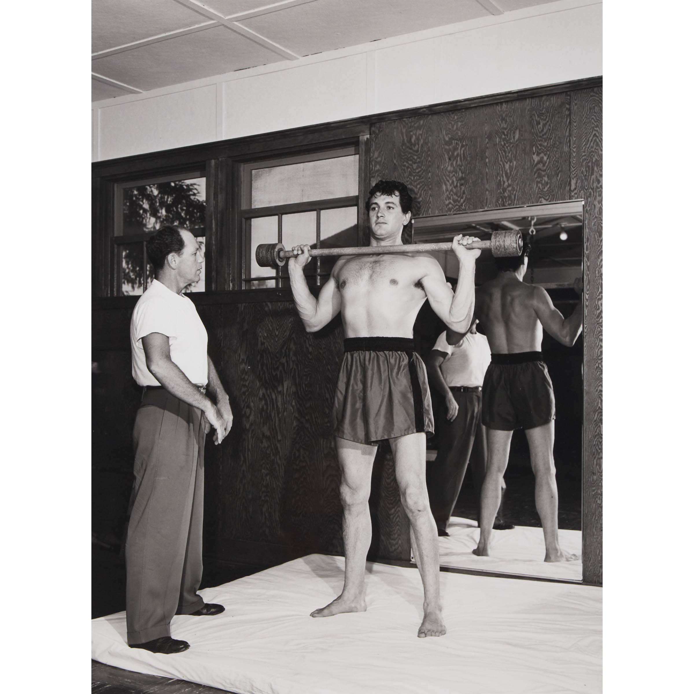 Rock Hudson Lifting Weights As His Trainer Watches, Saturday Evening Post