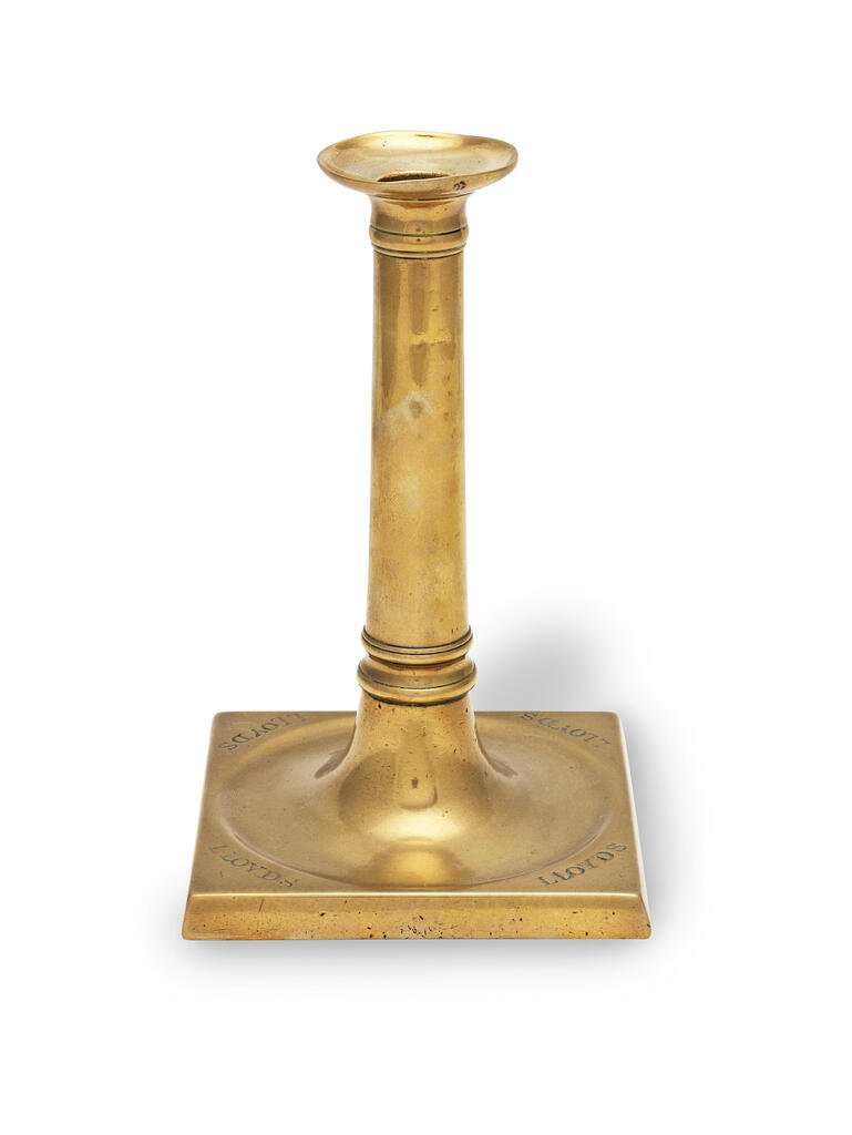 A late George III brass socket candlestick, circa 1800