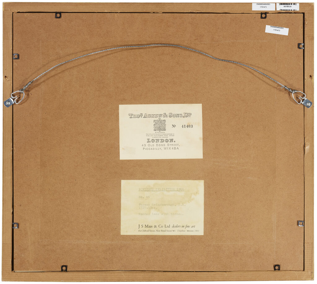 A wooded landscape with drovers and horses