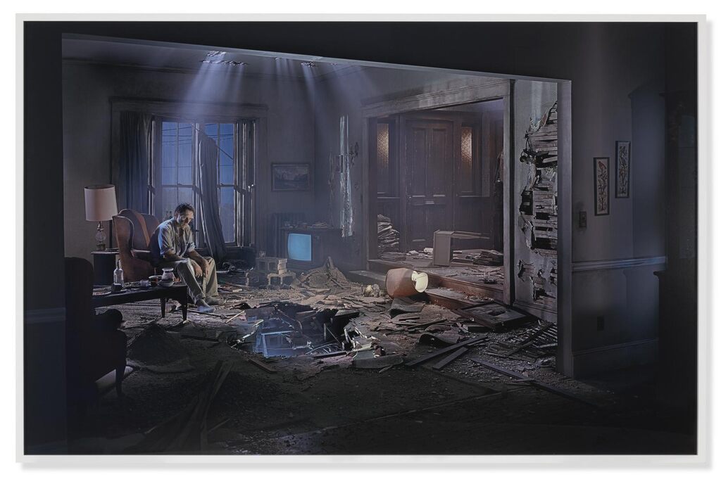Untitled (man in living room with hole)
