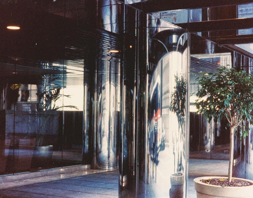 ”Anamorphic stainless steel column - NYC office bldg.”