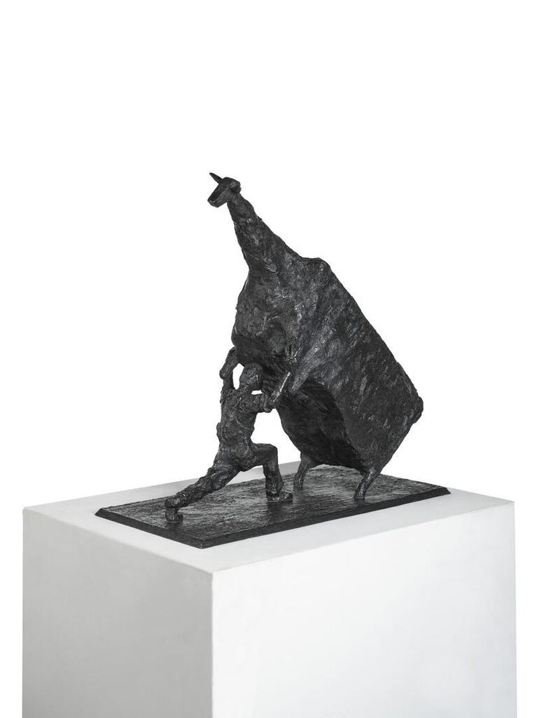 Man Lifting Cow
