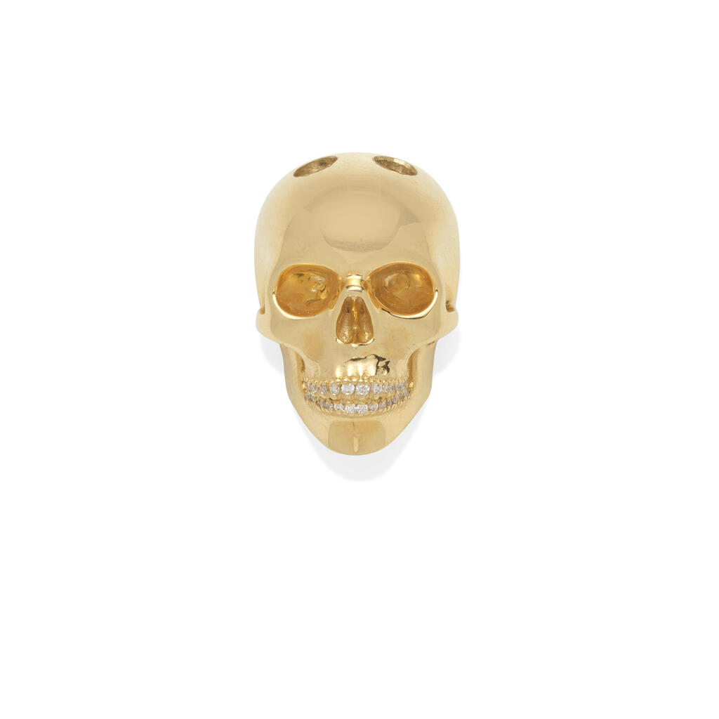 A 14K GOLD AND DIAMOND SKULL PENDANT