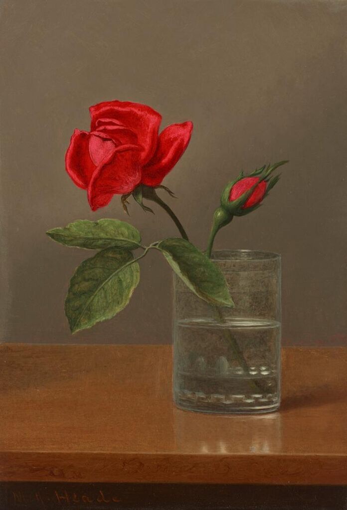 Red Rose and Bud in a Tumbler on a Shiny Table