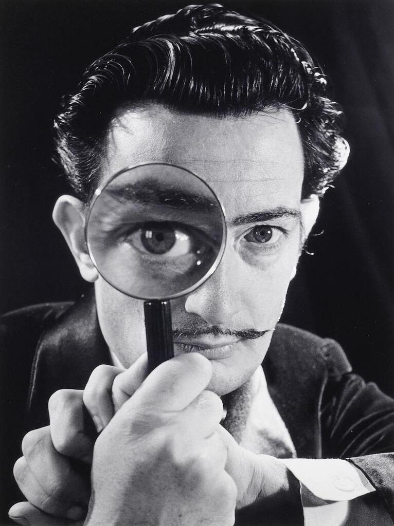 Salvador Dali with magnifying glass