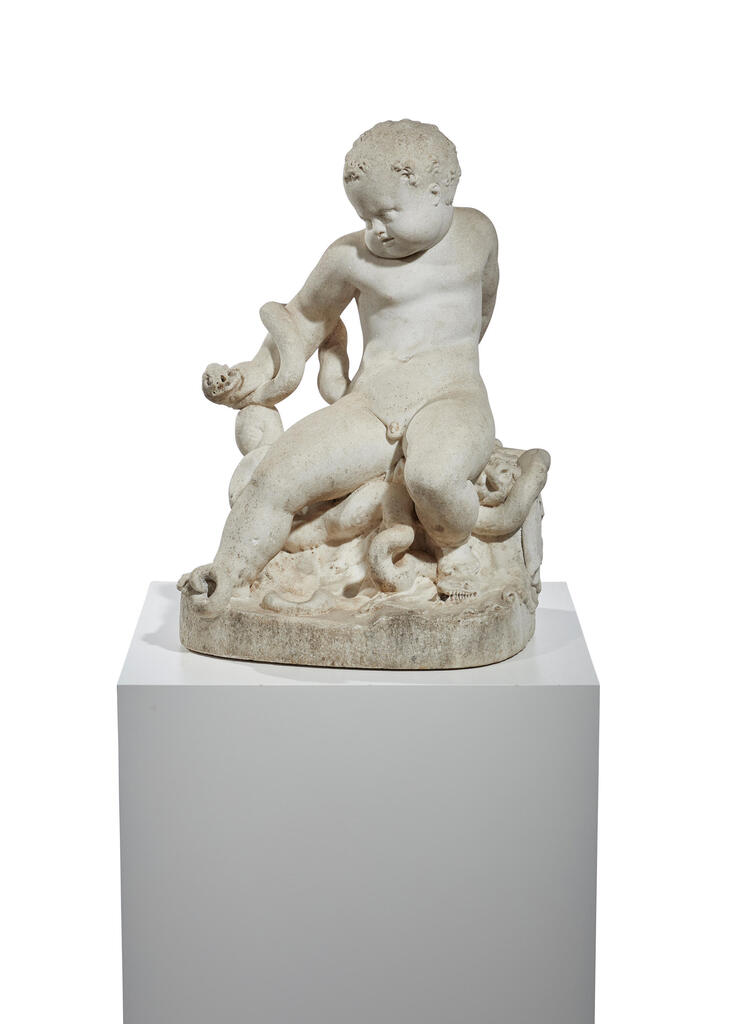 AN ITALIAN BAROQUE CARVED WHITE MARBLE GROUP OF THE INFANT HERCULES WRESTLING A SNAKE