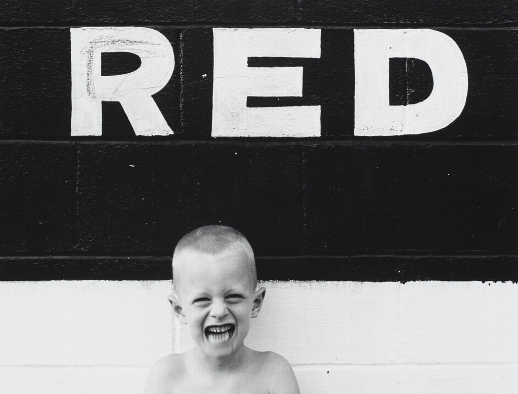 Untitled (Boy with Sign 'Red')