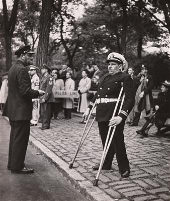 New York Parade. A veteran watches the parade march by