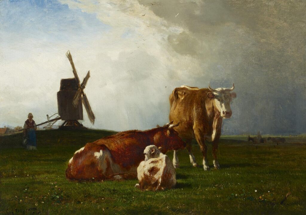 Trois vaches devant un moulin à vent