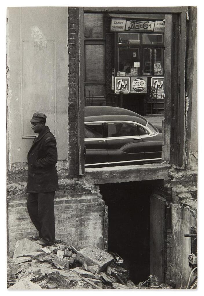 Man Standing Outside of a Building