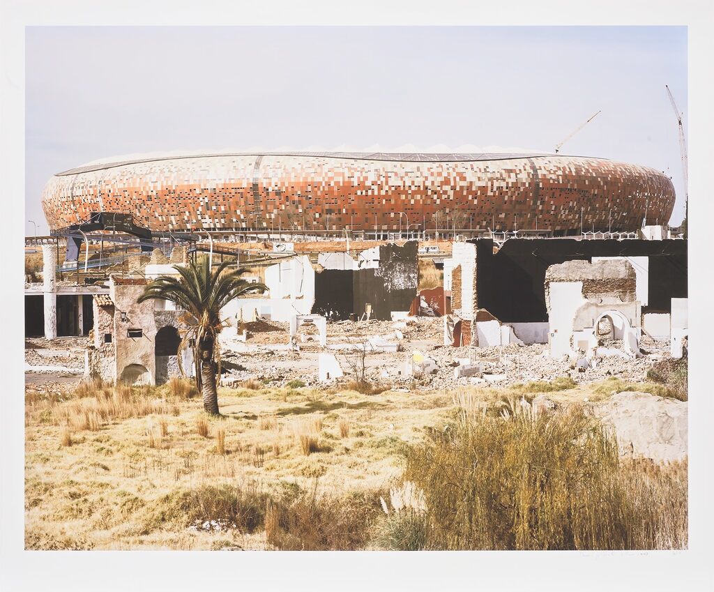 The ruins of Shareworld and FNB Soccer City Stadium. Shareworld, intended as a theme-park to the people of Soweto, was built and went bankrupt in the late 1980s.