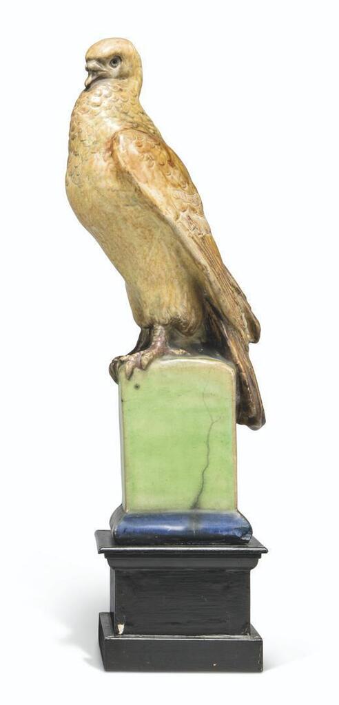 Modelled as a bird perched on a column