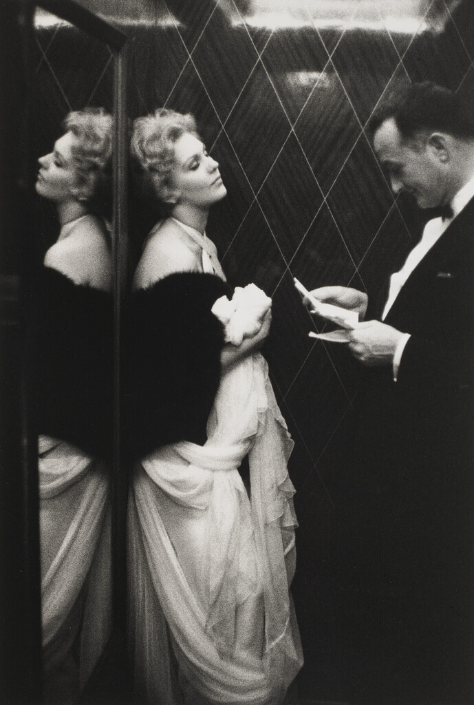 Kim Novak and Rupert Allan of Look Magazine in the lift of the Carlton Hotel, Cannes, 1956