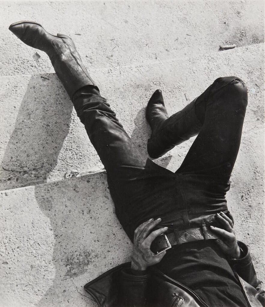 Untitled [man in cowboy boots resting]