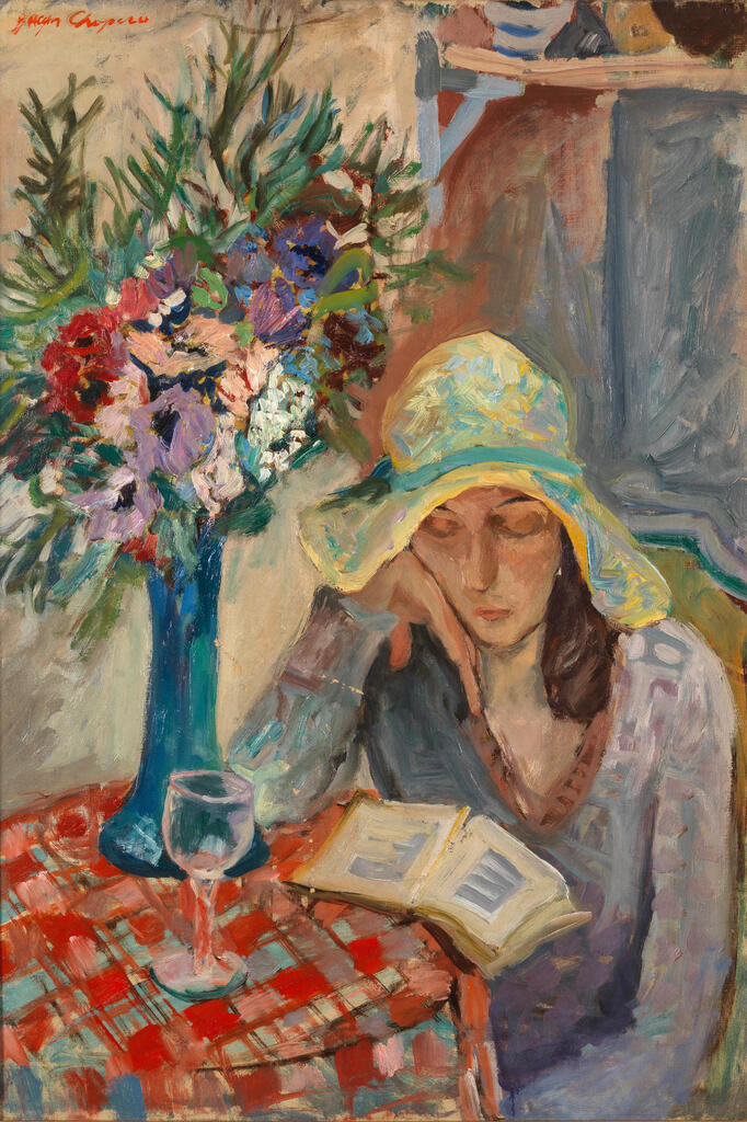 Interior with a woman reading