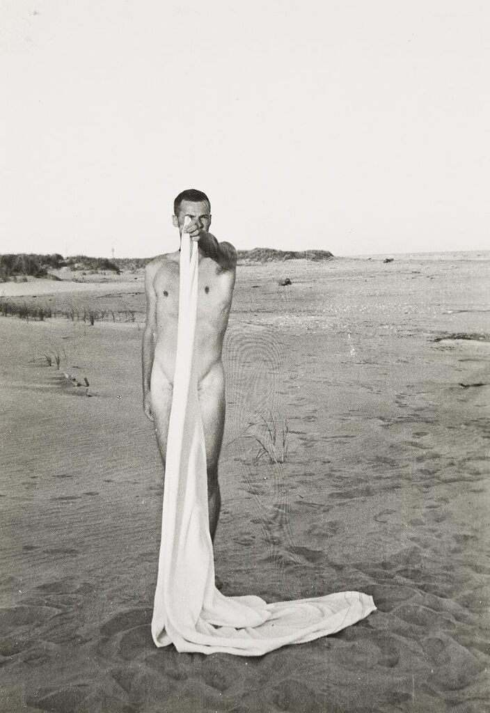 Glenway Wescott with beach towel, Fire Island