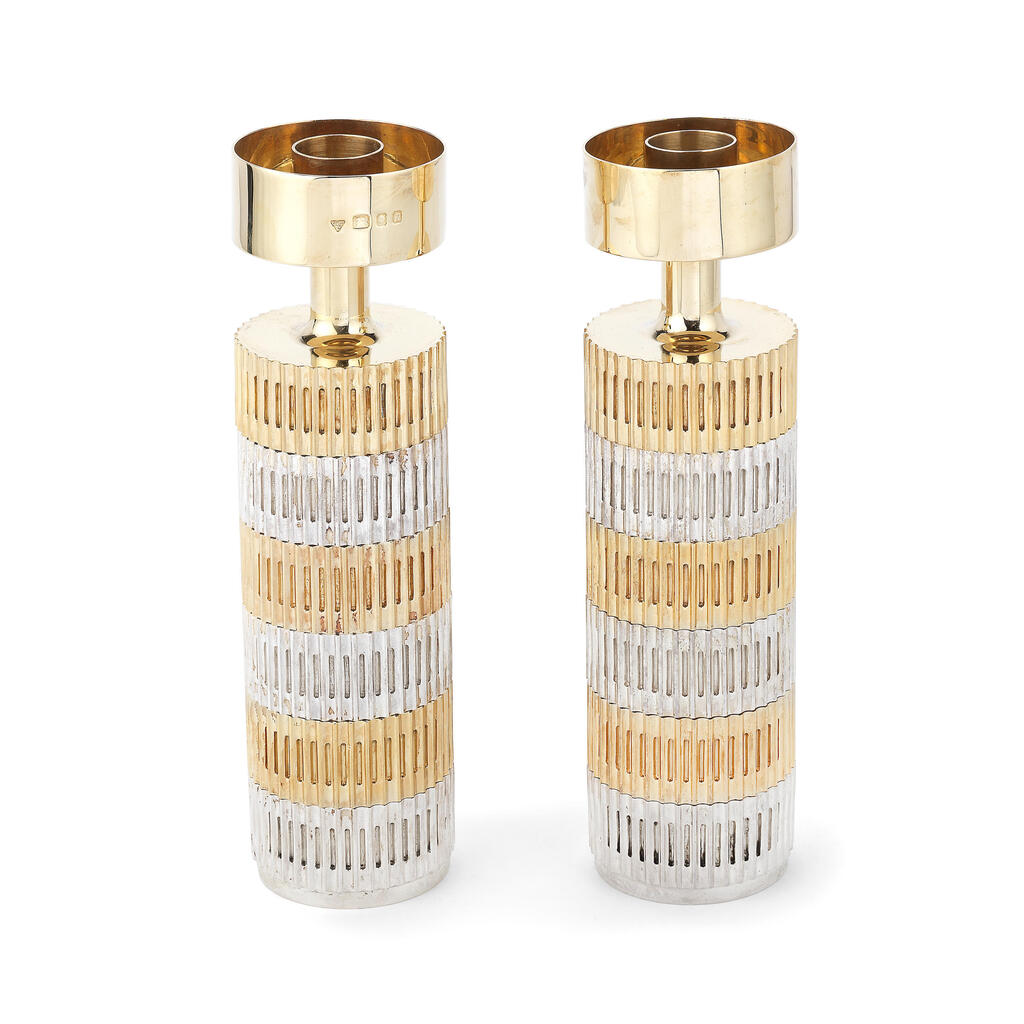 ALEX STYLES FOR GARRARD: an unusual pair of silver and silver-gilt candlesticks