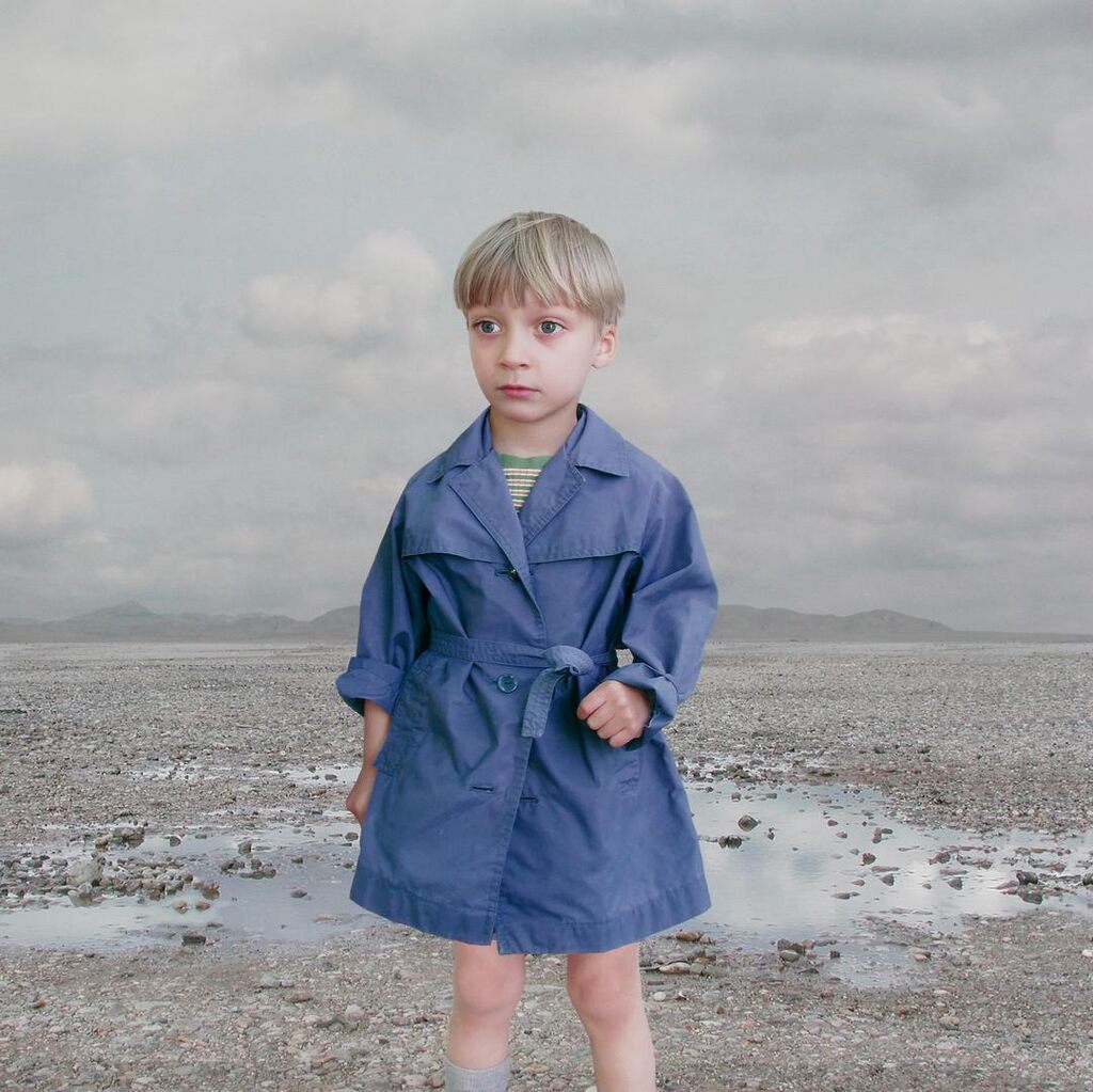 'Boy in a blue raincoat 2'