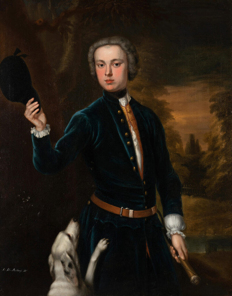 Portrait of Sir John Shuckburgh, 3rd. Bt, three-quarter-length, in a blue velvet coat, holding a crop, standing in a landscape with his hound