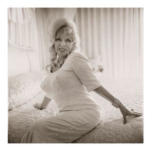 Diane Arbus (1923-1971); Mae West on her bed, Santa Monica, CA;