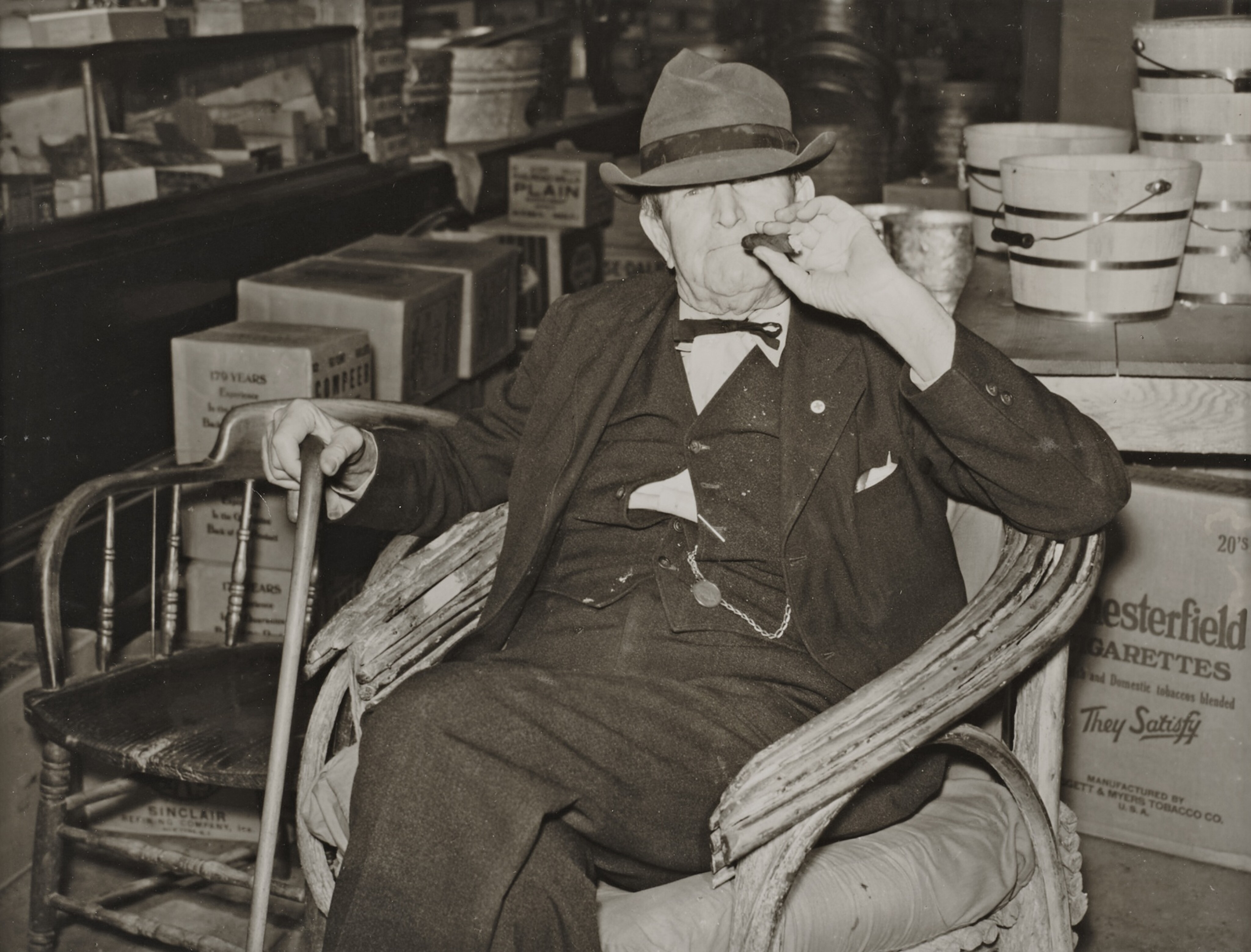 ‘Mr. RB Whitley visiting in his general store.’