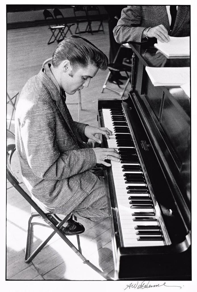 Elvis Presley relaxing at the piano, plays a hymn, June 29, 1956
