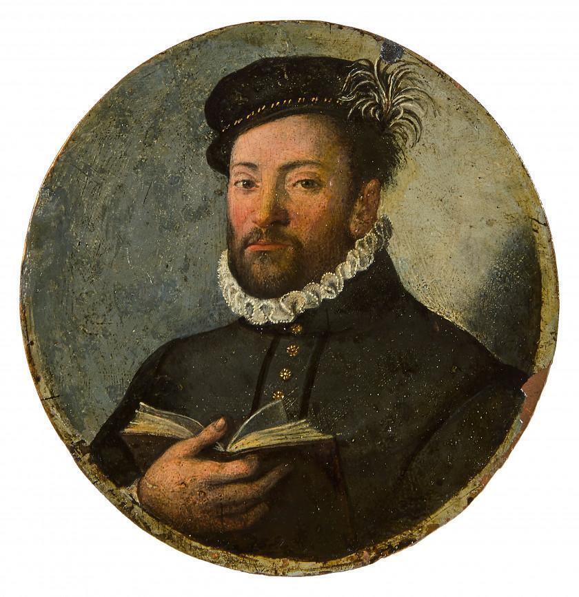 Portrait of man holding a book
