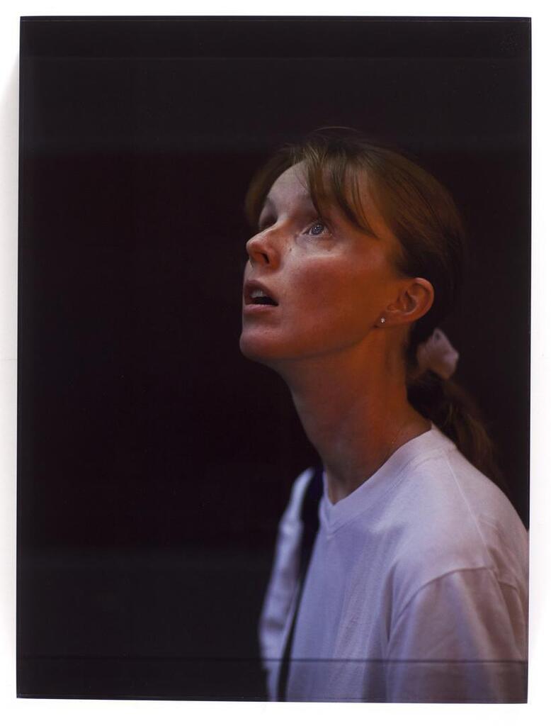 'Young Woman in White T-Shirt Looking Up, 42nd Street, NY'