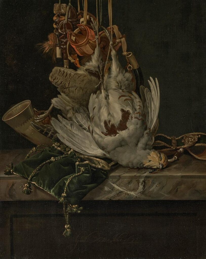 A partridge, a hunting horn, hawking hoods and a gold-trimmed green velvet hunting bag hanging above a marble ledge