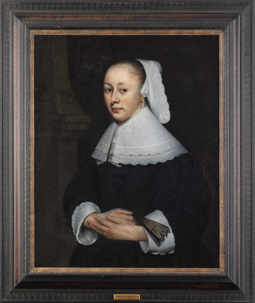 Portrait of a lady, half-length, in a black dress holding a fan