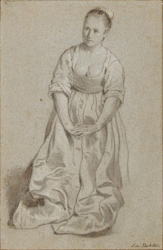 A kneeling woman