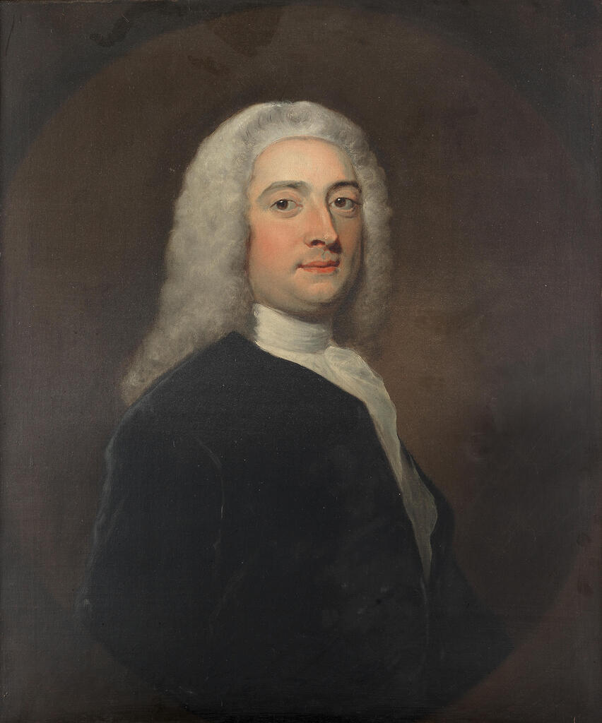 Portrait of a gentleman, half-length, in a blue coat, within a painted oval