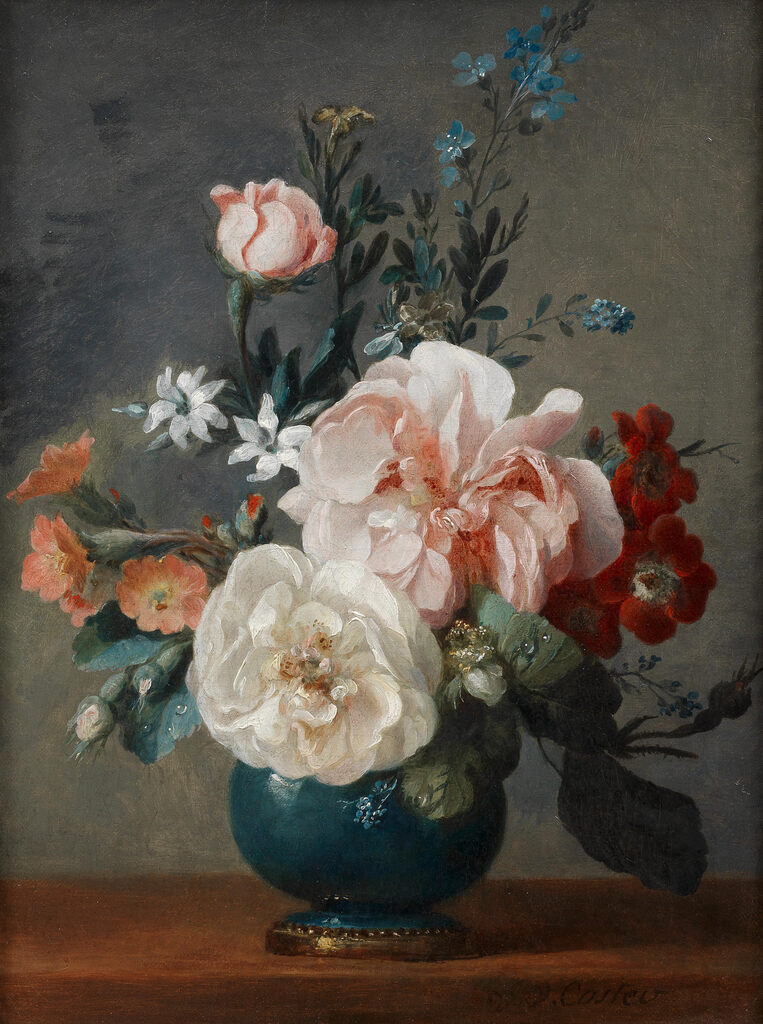Roses, orange blossom and other flowers in a blue vase