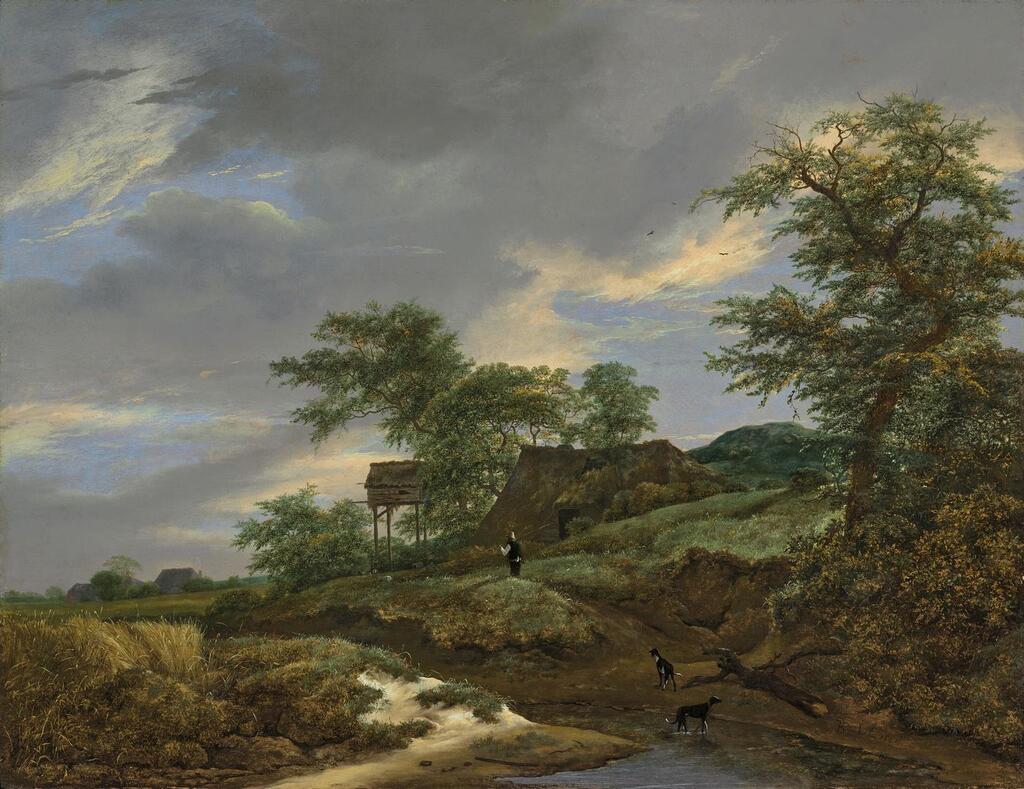 A wooded landscape with a man and two dogs on a path, a cottage beyond