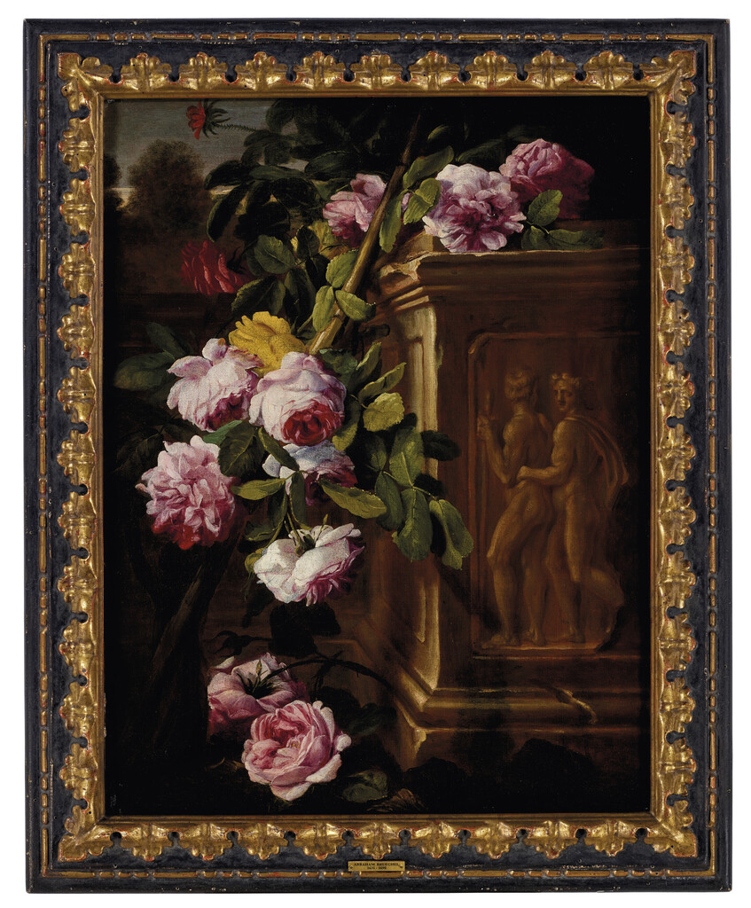 Roses in a garden with a sculpted plinth