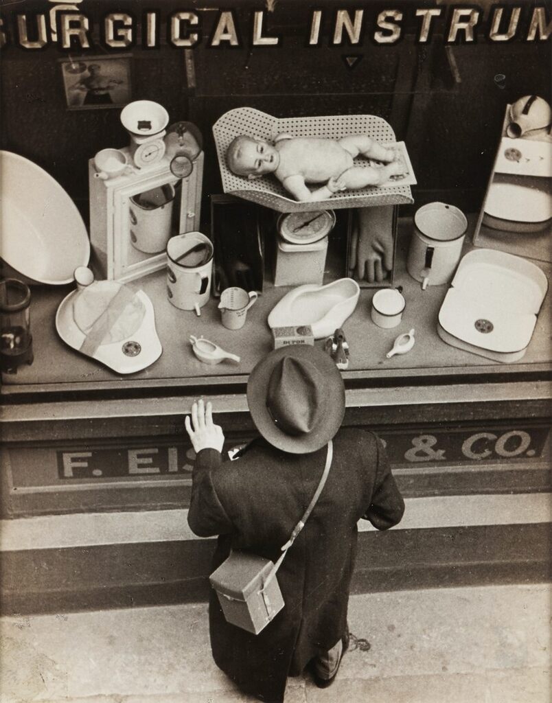 Untitled (man gazing in shop window)