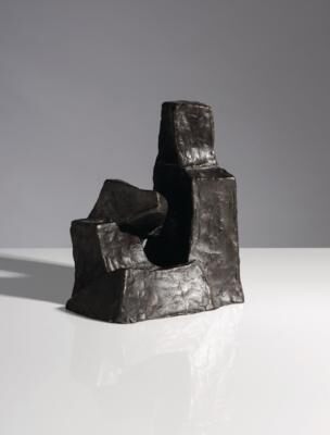 Small seated figure