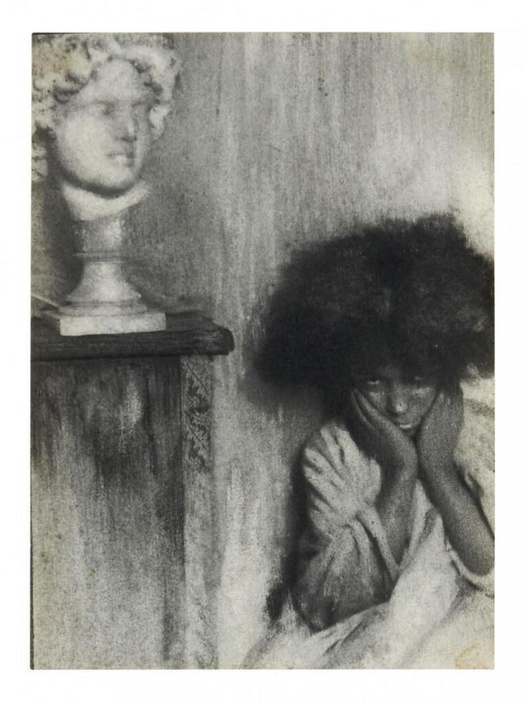 Young woman and marble head