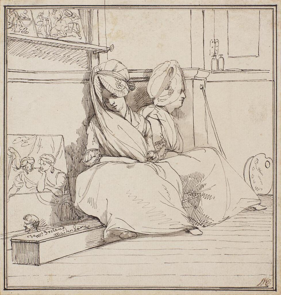 Two ladies sitting in the corner of a studio