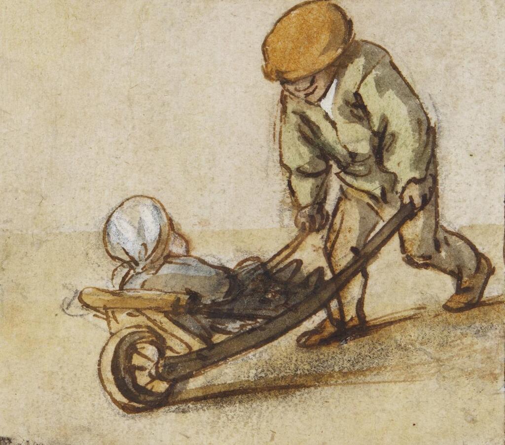A boy pushing an infant in a wheelbarrow