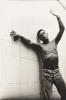 Paul Cadmus with a canvas for the Richmond, VA mural "Pochahntas Saving the Life of Captain John Smith," possibly a self-portrait. Circa 1940s.