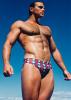 An archive of 11 sets of photographs in their original envelopes, comprising approximately 81 male physique images primarily depicting the iconic model John Pruitt. Circa 1988.
