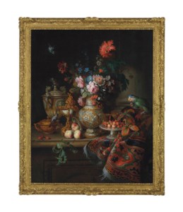 Roses, carnations, morning glories and flowers in a parcel-gilt vase, a nautilus shell goblet, a parcel-gilt two handled cup and porringer, strawberries on a tazza with other utensils with a green parrot and chaffinch on a partly draped stone ledge