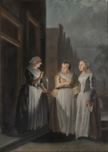 Trois femmes parlant de nuit à la lumière des bougies dans les rues d'une ville hollandaise