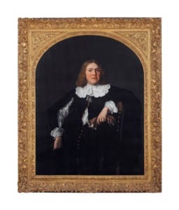 Portrait of a gentleman, three-quarter-length, in a black coat and shirt with lace collar and cuffs, holding gloves in his left hand, leaning against a chair
