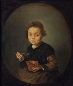 Portrait of a little girl eating porridge, in a feigned oval