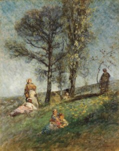 A young family under trees on a hill