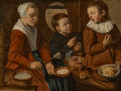 Three children in a kitchen interior